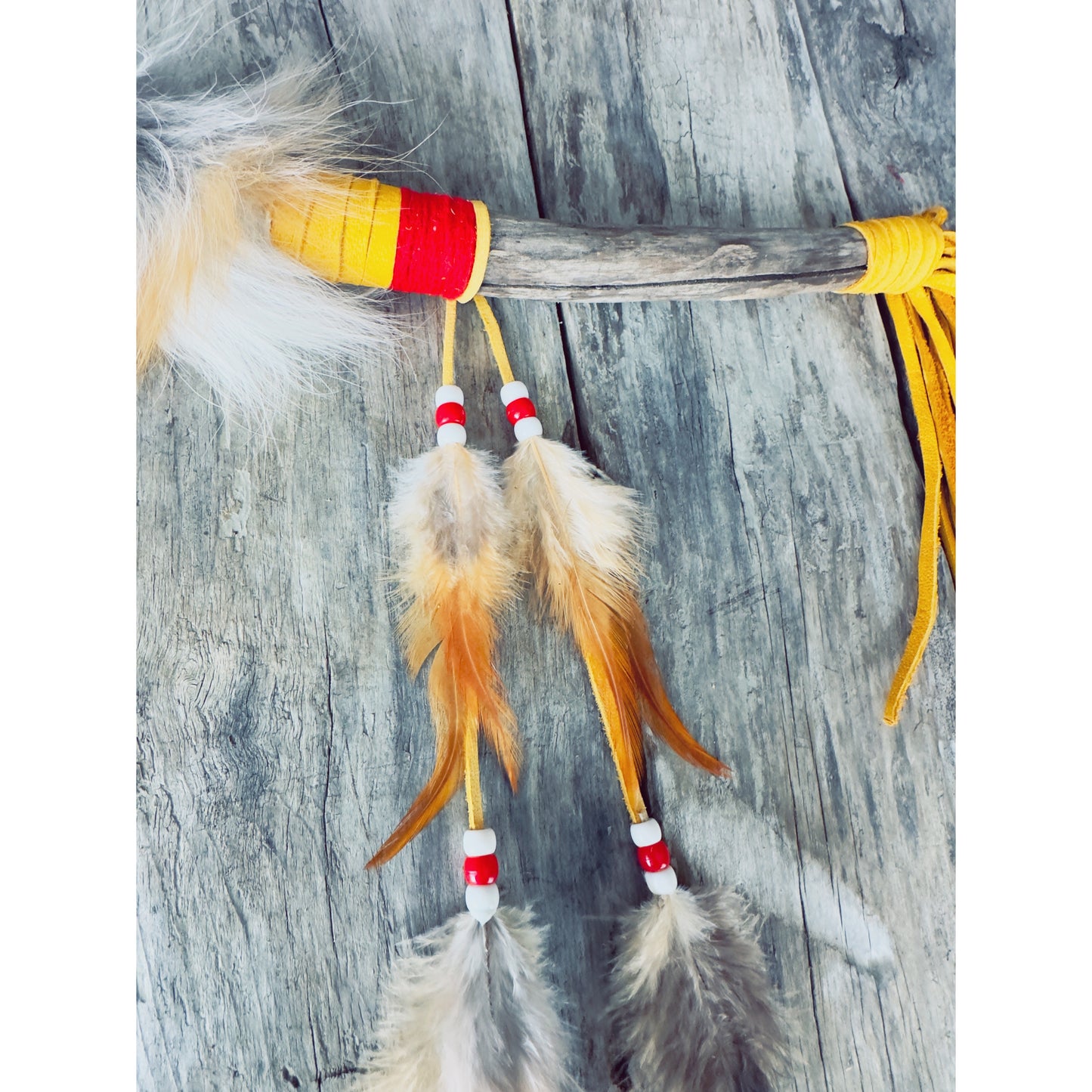 Talking stick with grey and gold tones, boreal-inspired Indigenous creation