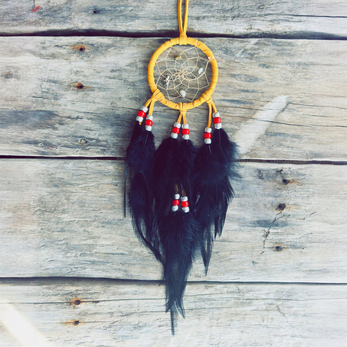 Handmade Indigenous dreamcatcher crafted with natural materials