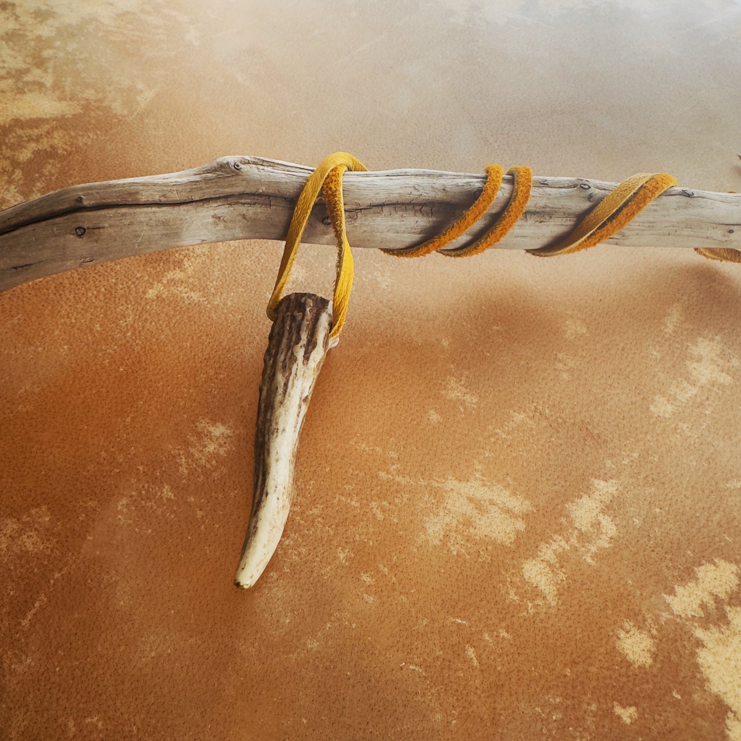 Indigenous handmade necklace featuring natural deer antler and moose leather cord