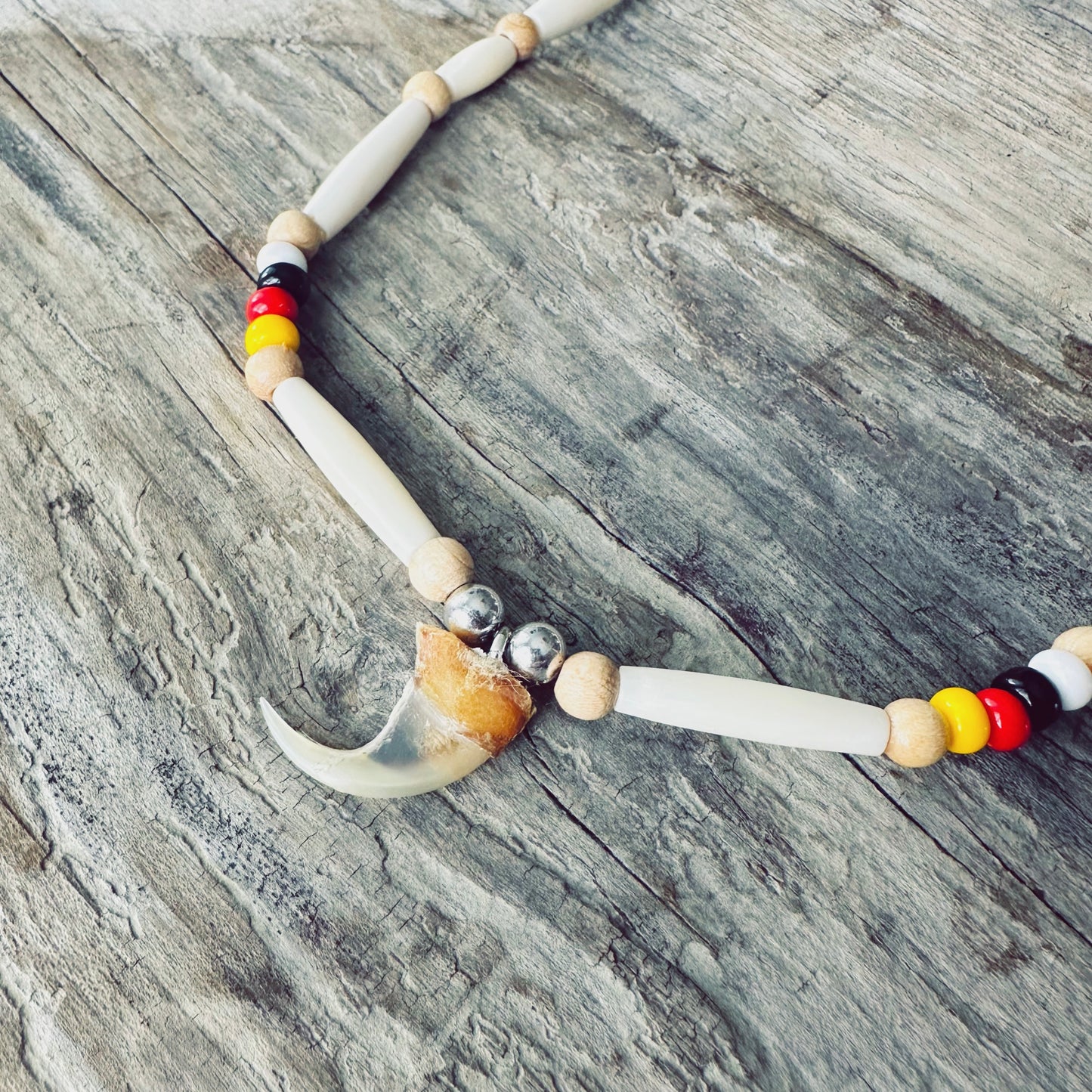 Indigenous bone bead and lynx claw necklace | Moose hide