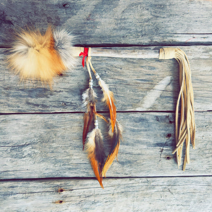 talking stick, brown leather, fox fur, red fabric