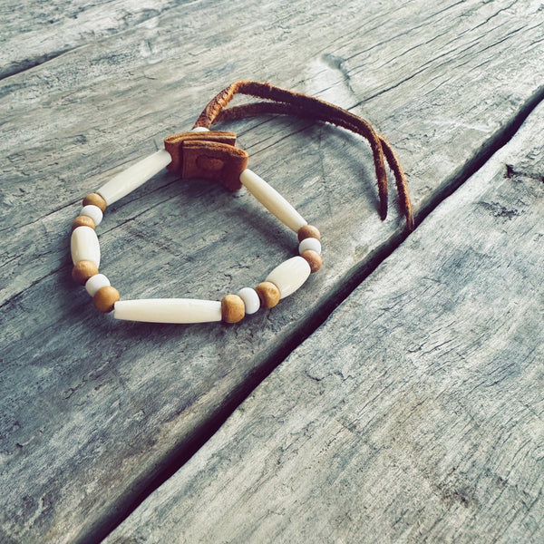 Innu leather and white pearl bracelet handmade by an Innu artisan