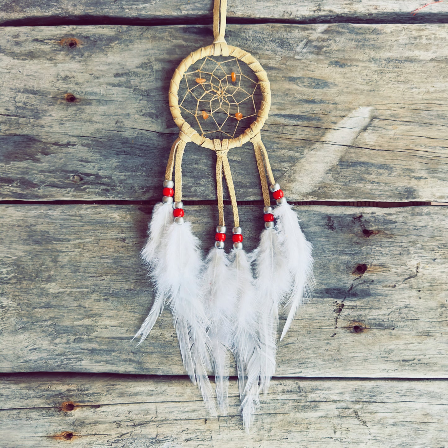 Indigenous ceremonial dreamcatcher handcrafted for spiritual balance and protection