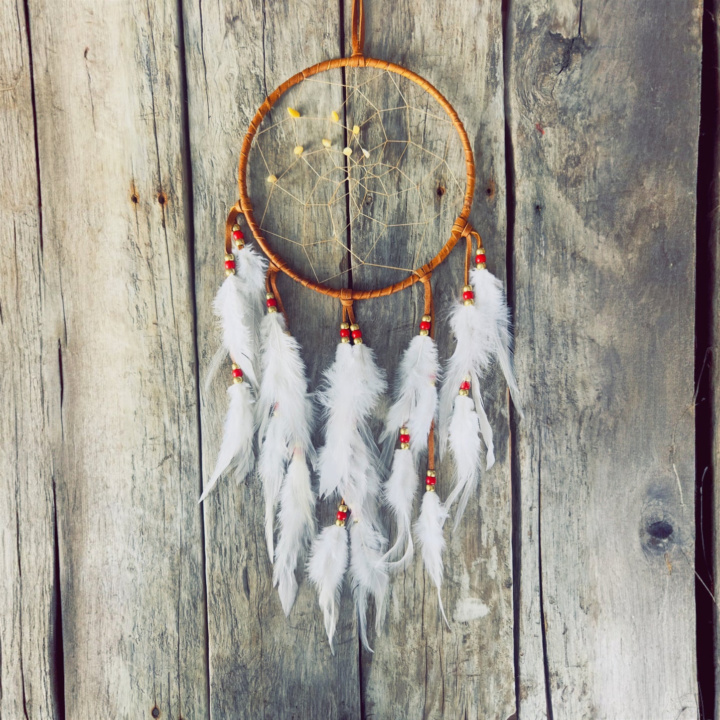Artisan dreamcatcher with natural feathers