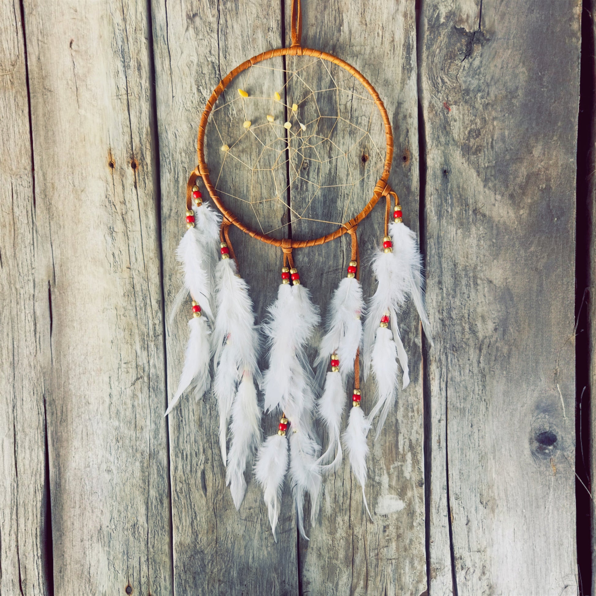 Artisan dreamcatcher with natural feathers