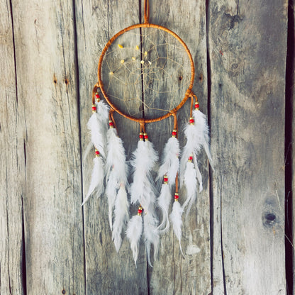 Artisan dreamcatcher with natural feathers