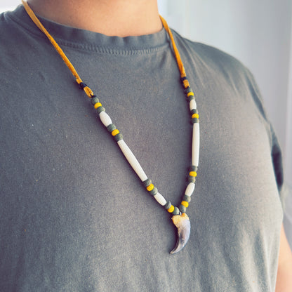 Handcrafted bear claw necklace made with genuine moose leather