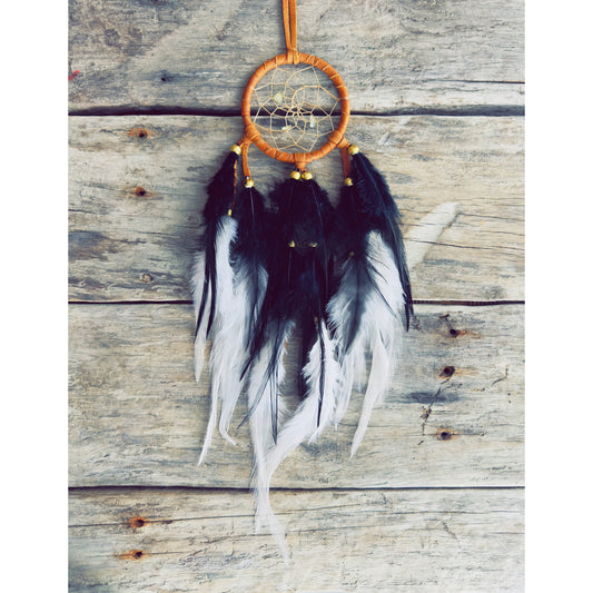 Artisan-made dreamcatcher crafted with natural materials and symbolic details.