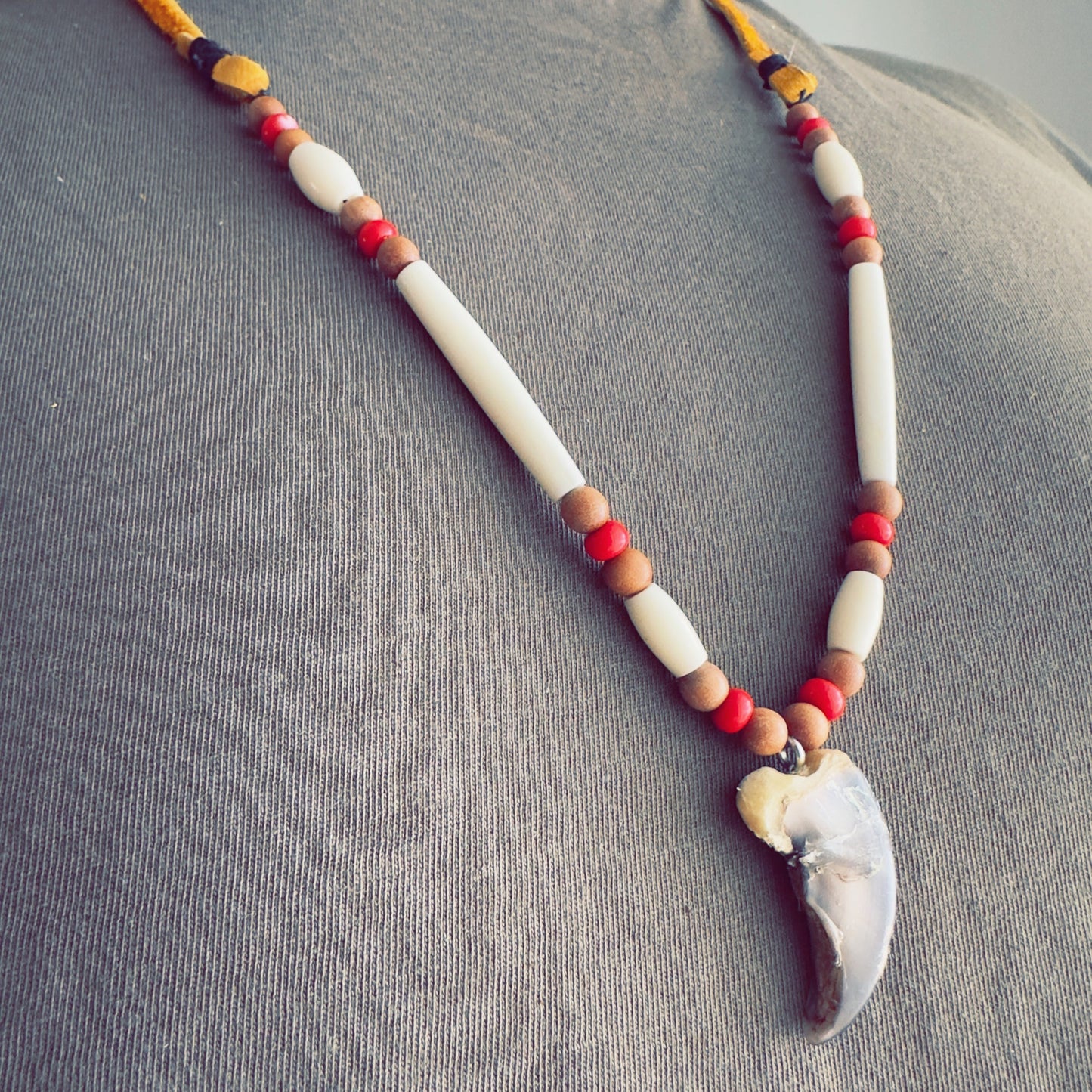 Earth-tone Indigenous necklace with natural beads and cultural influence