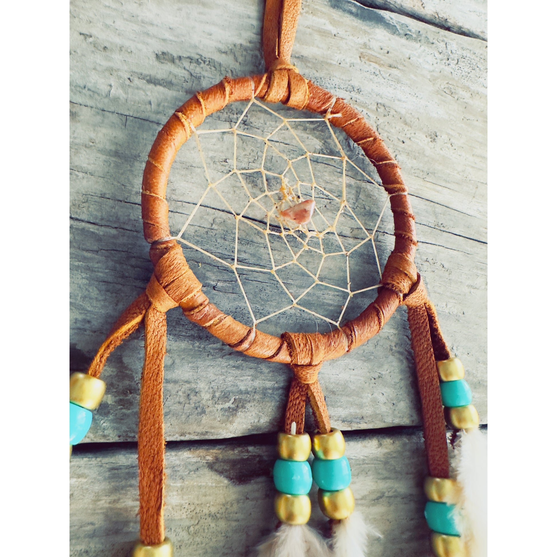 Dreamcatcher reflecting Native symbolism, representing harmony, wisdom, and the circle of life in spiritual tradition.