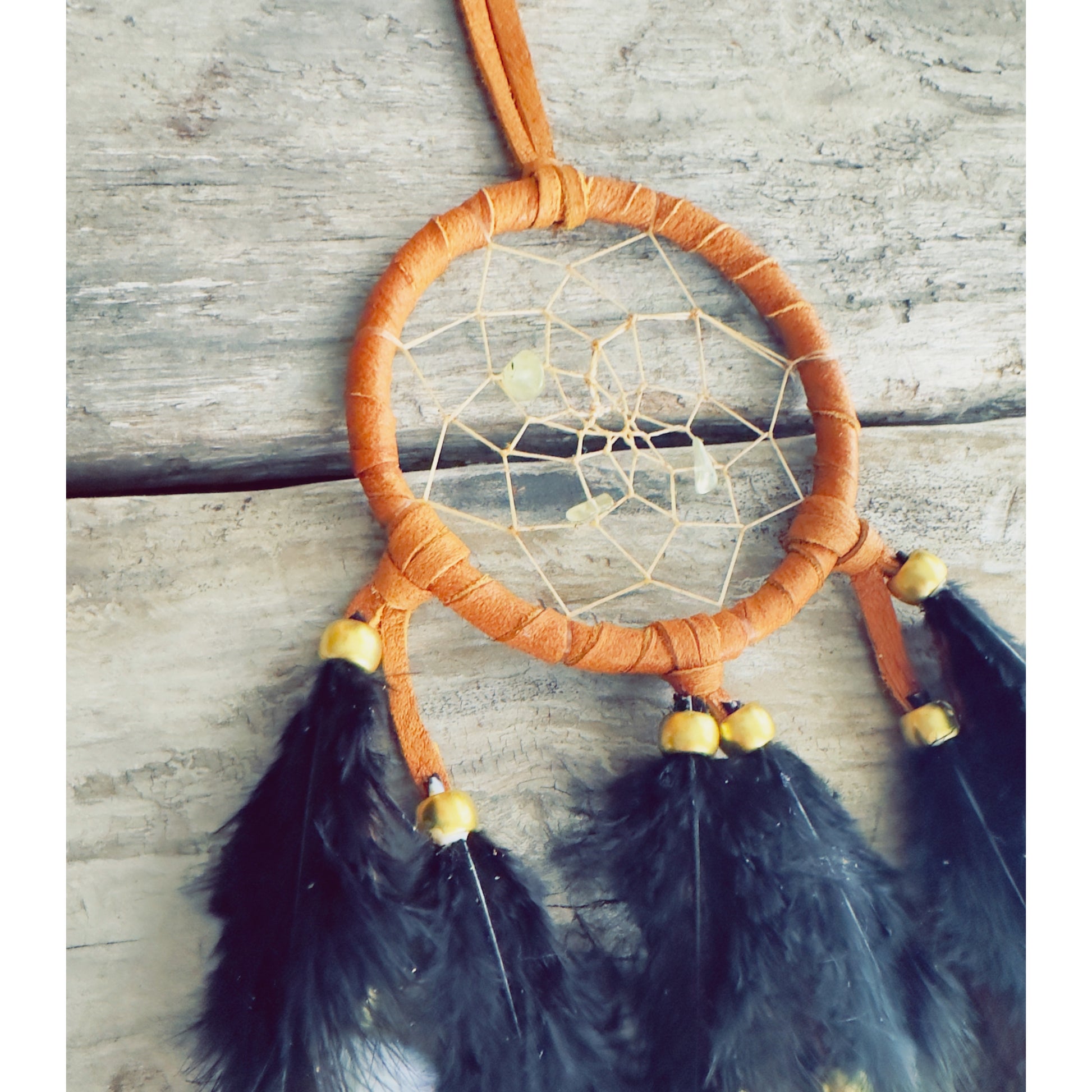 Premium handmade Native-style dreamcatcher crafted with natural feathers and detailed artistry.