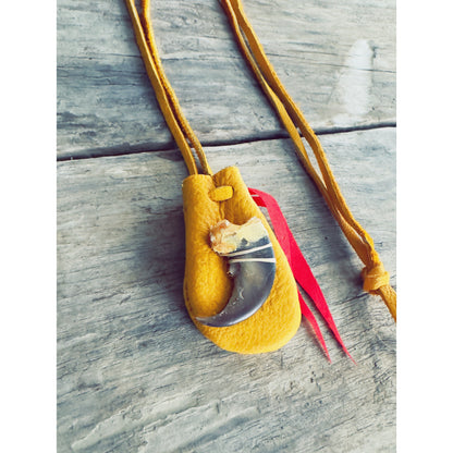 Small Indigenous medicine pouch with animal claw detail and leather cord