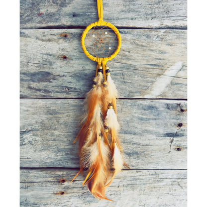 Spiritual handmade dreamcatcher infused with Native wisdom, meant to purify dreams and bring peace.